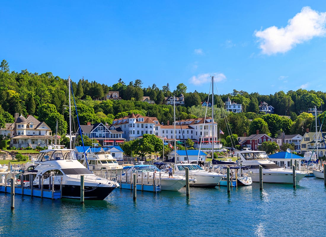 Marine City, MI - Sail Boats Docked by Homes on a Sunny Day